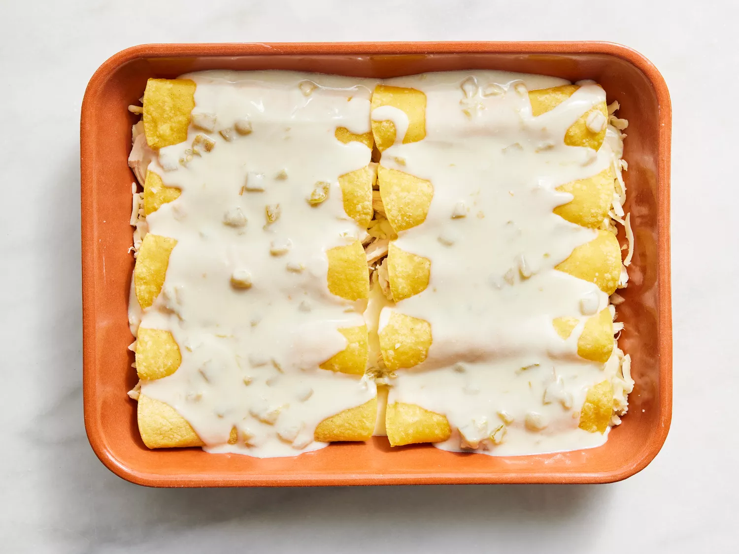mixture poured over enchiladas.
