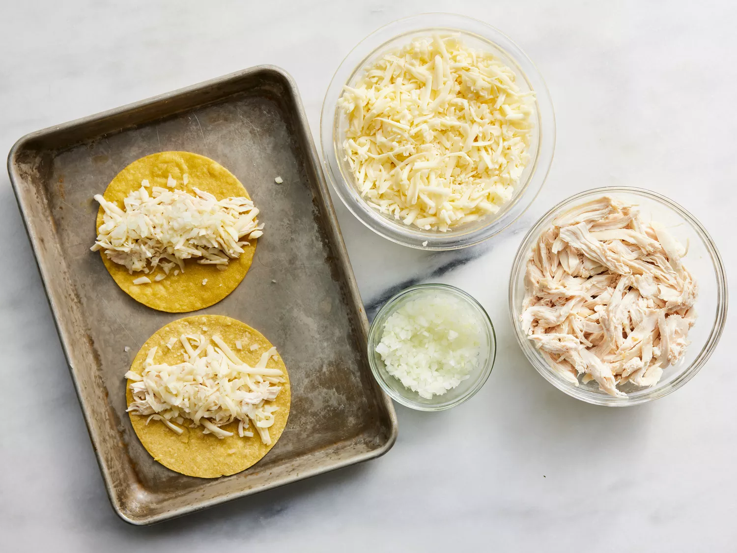 chicken, cheese and onion divided among tortillas.