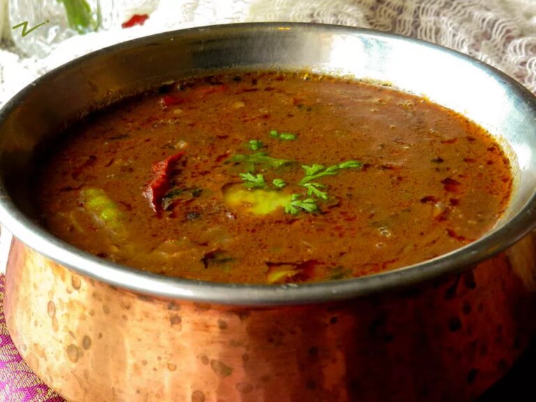 Close up view of dal makhani (indian lentils) in a metal pot