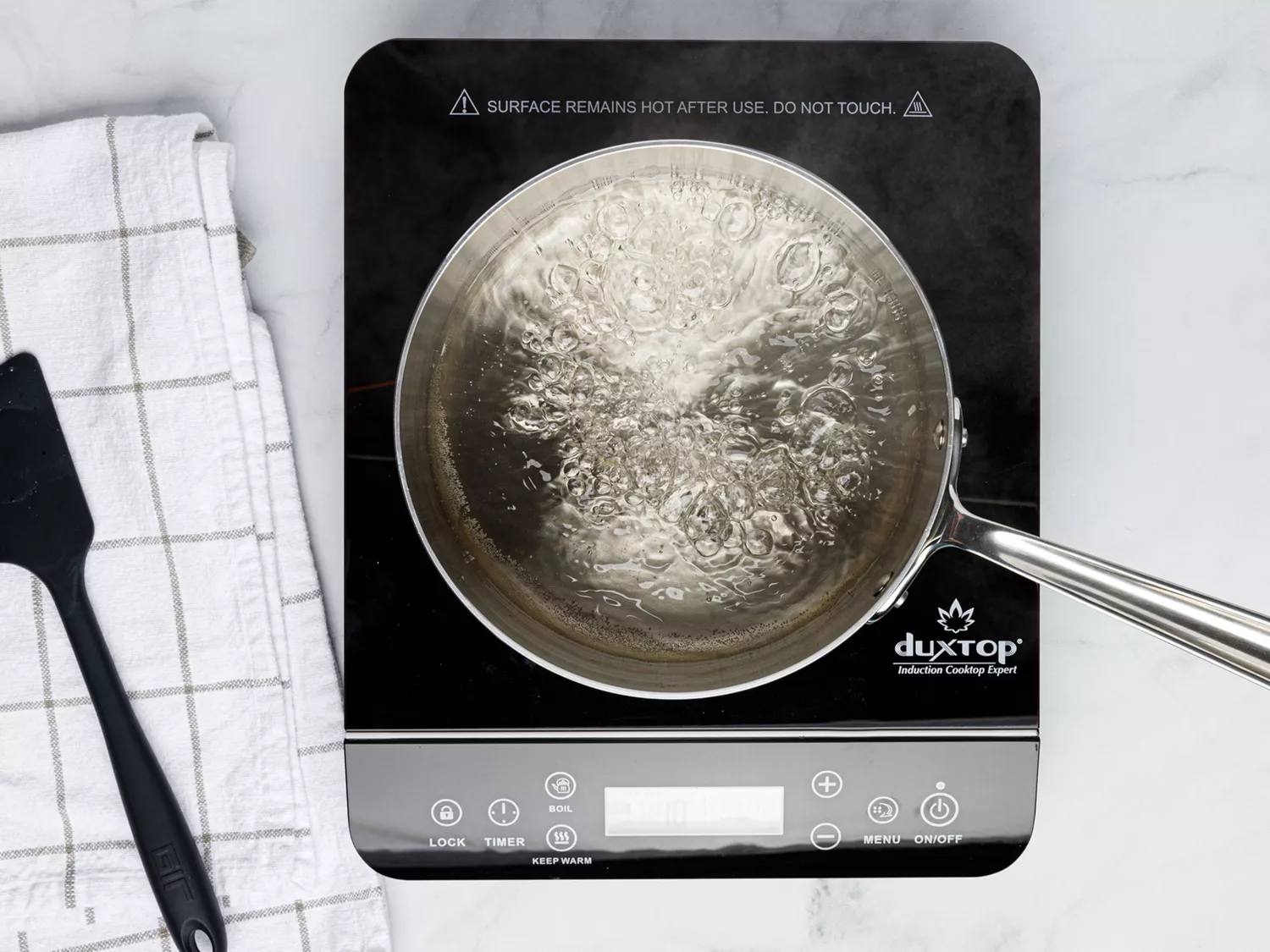 Water boiling in saucepan 