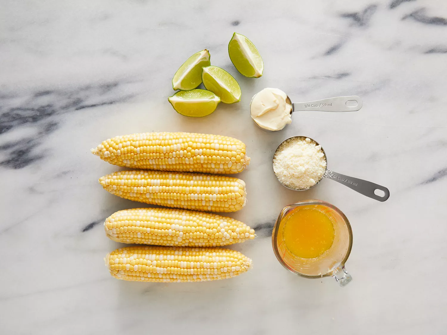 Overhead of Elote ingredients resting on a counter. 