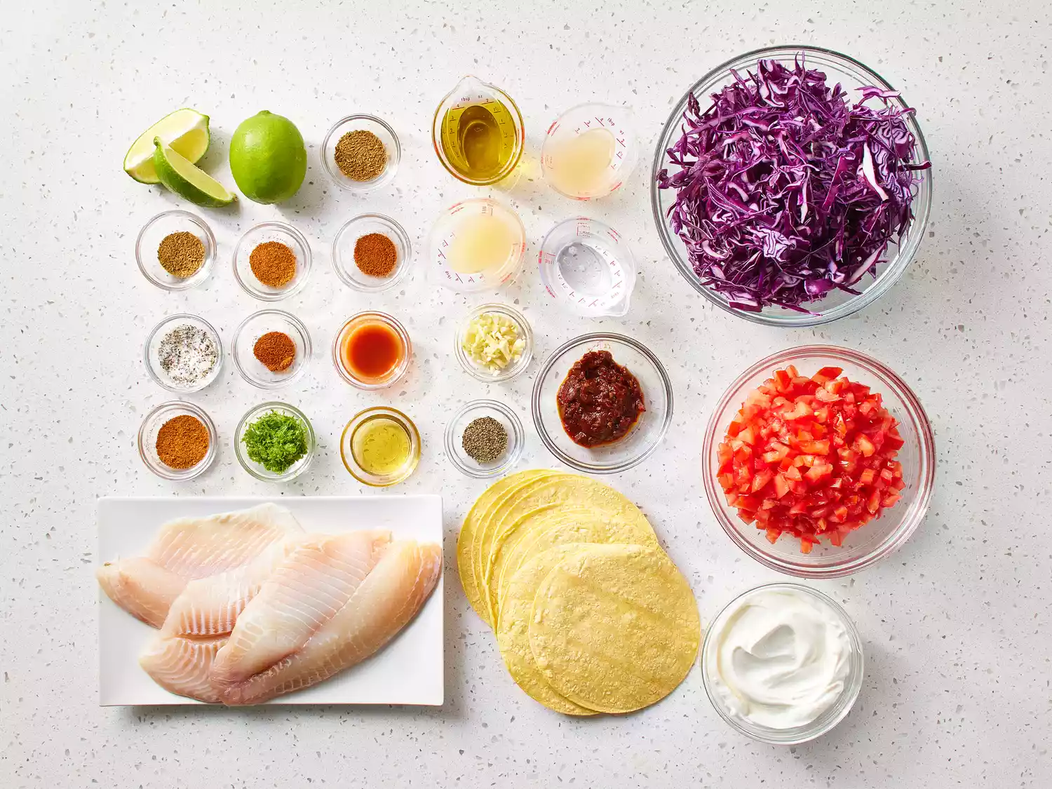 Grilled Fish Tacos with Chipotle-Lime Dressing ingredients on a counter 