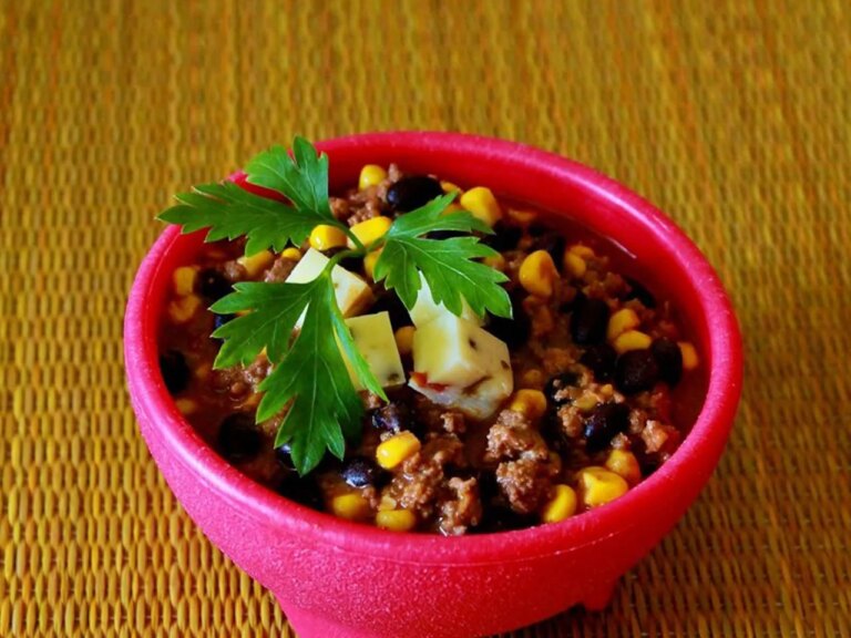 Southwestern black bean stew in hot pink bowl