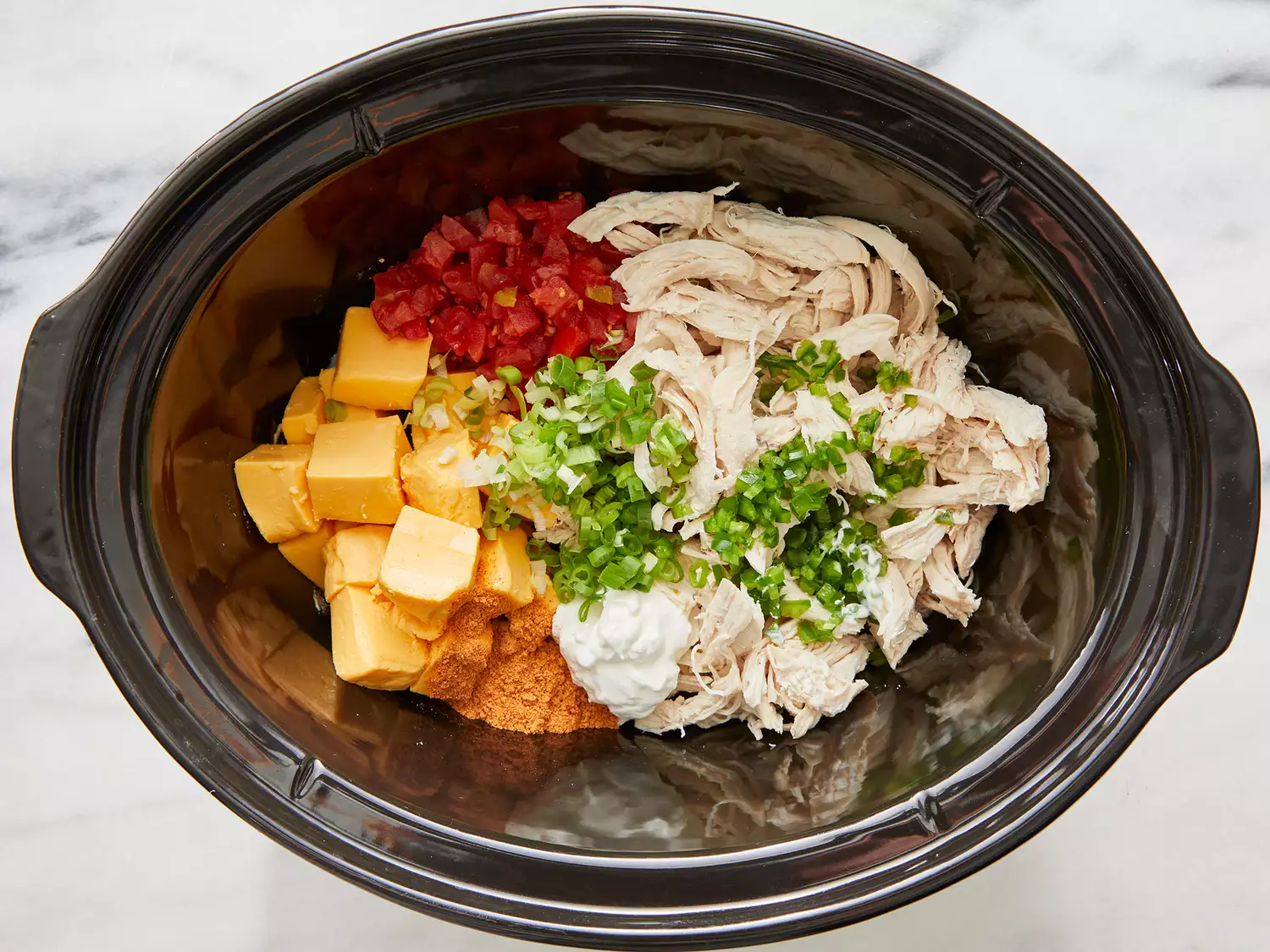 Ingredients stirred together in a slow cooker.