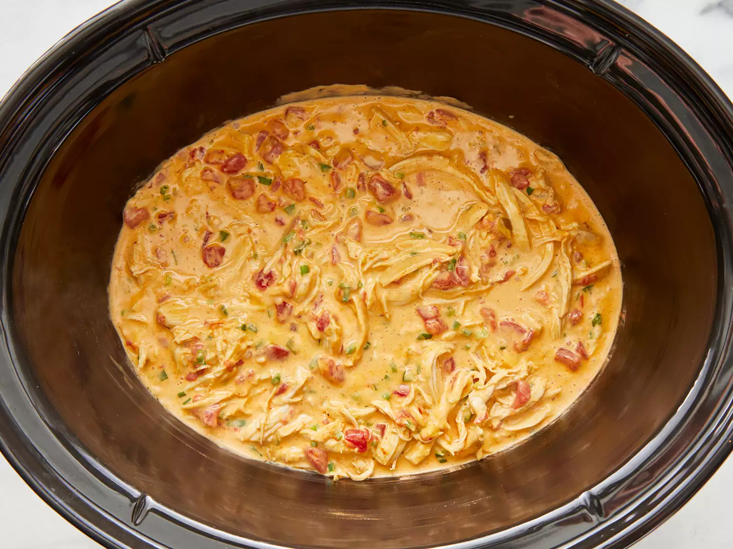 Ingredients cooked together until cheese is melty and dip is hot.