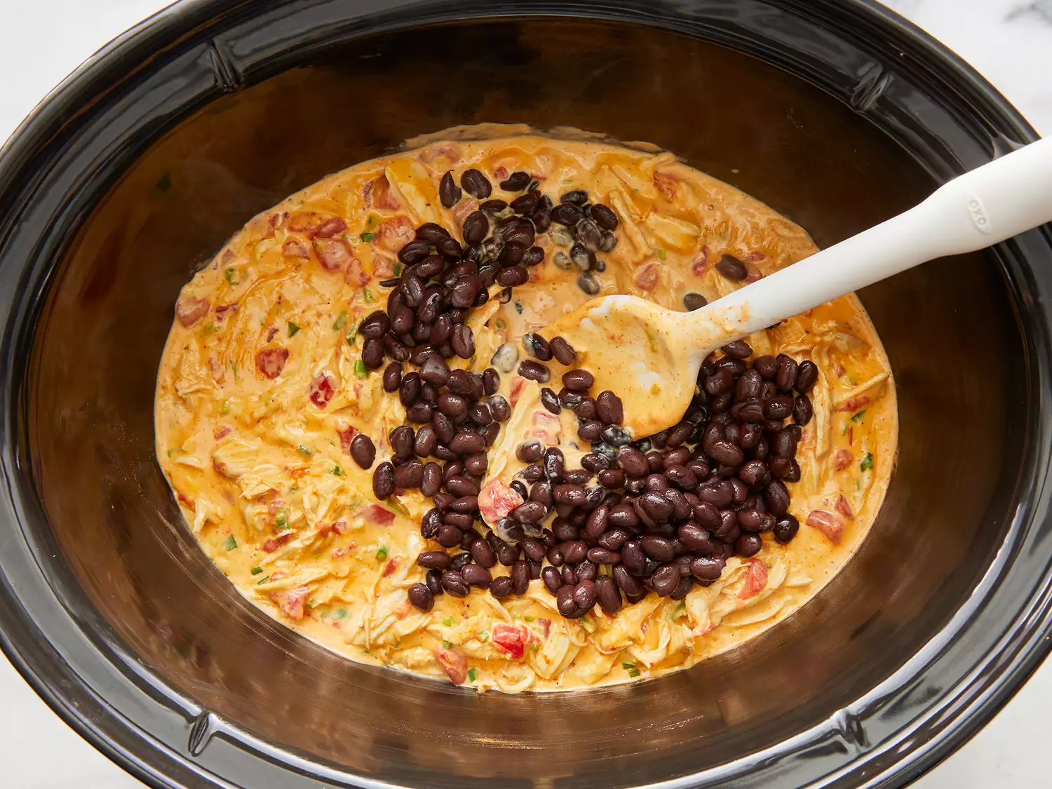 Black beans added to dip and cooked until heated through. 