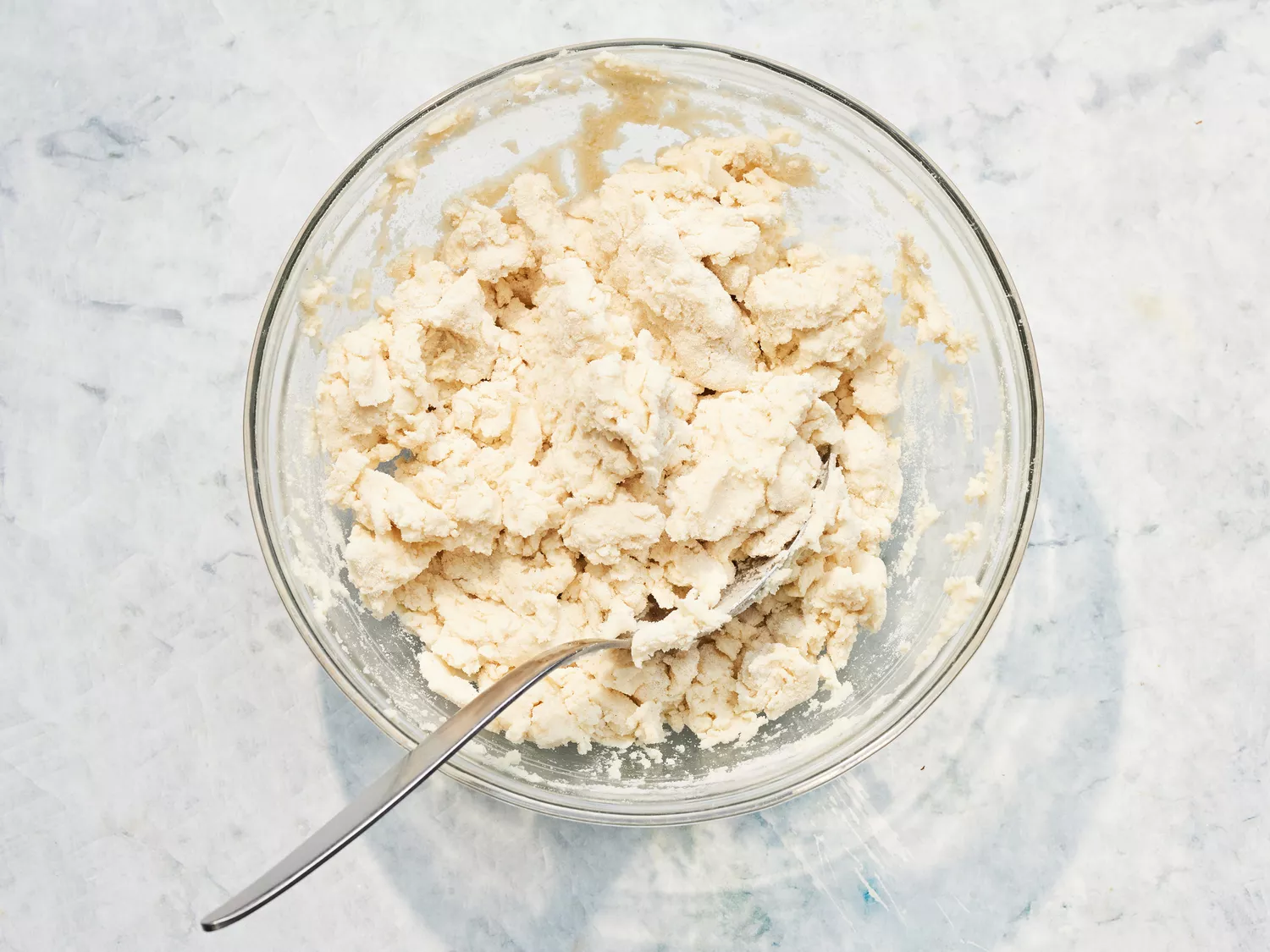 masa harina and hot water combined in a medium bowl.