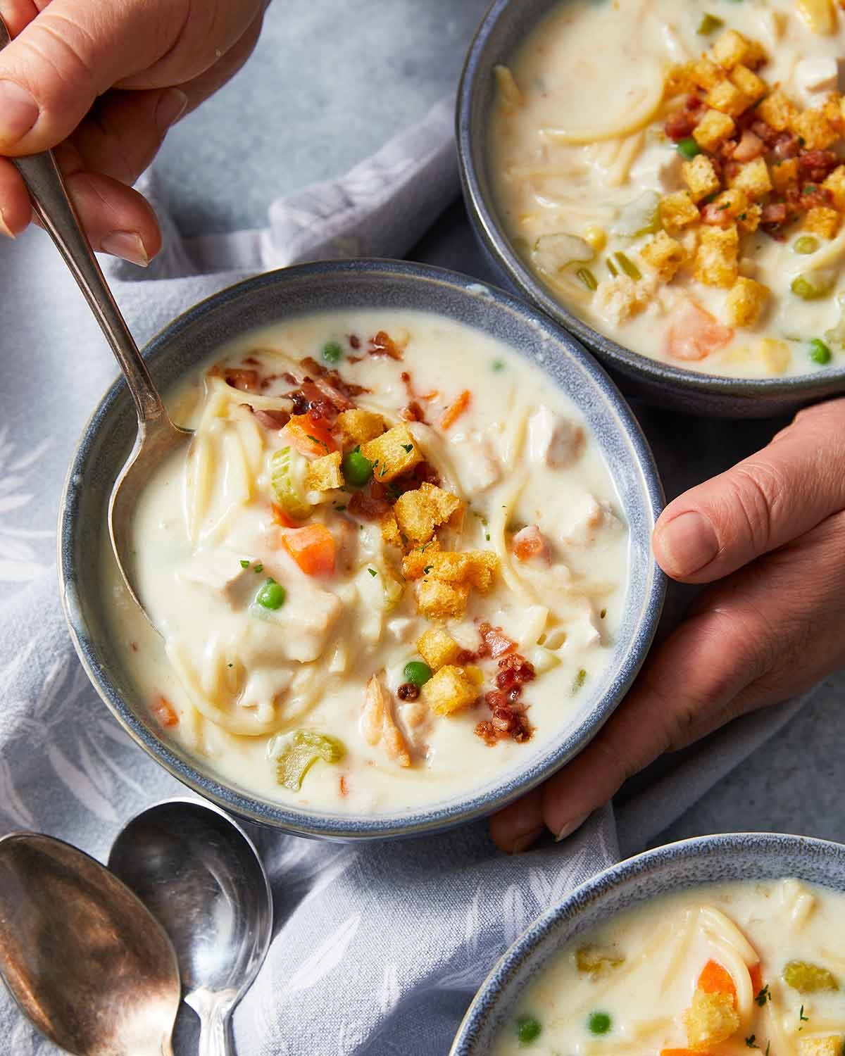 Creamy chicken noodle soup with mini croutons Recipe Creamy chicken noodle soup in bowls