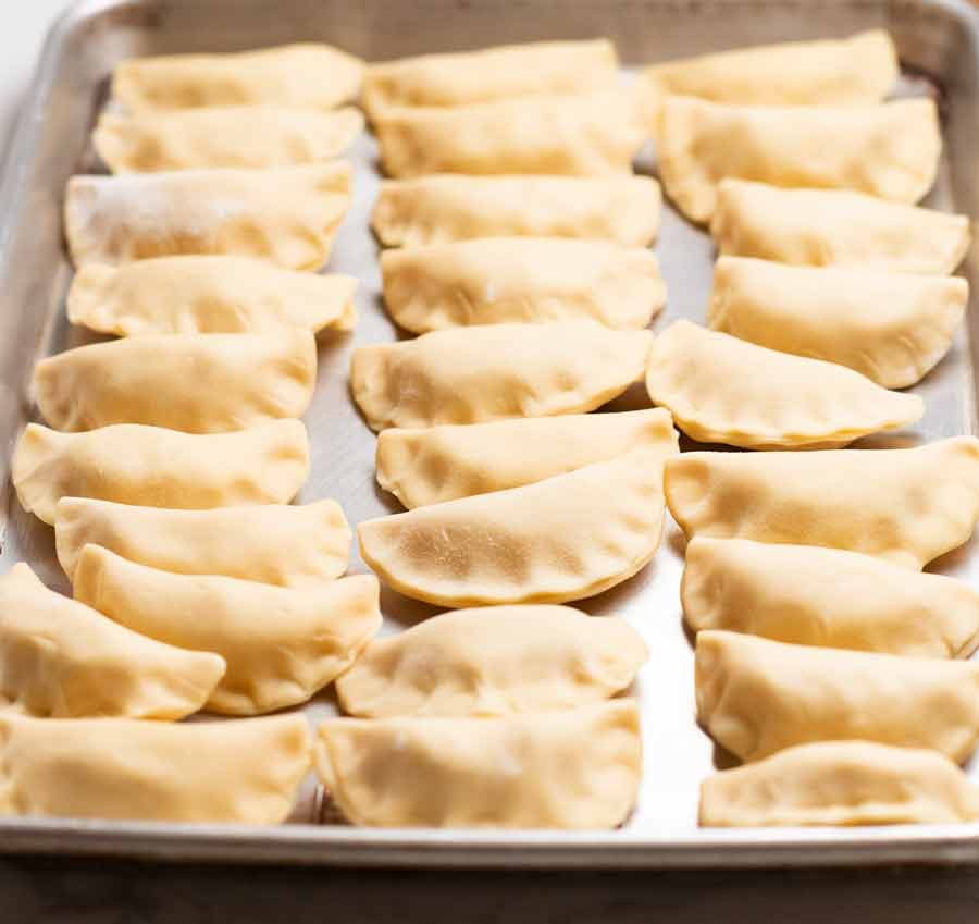Pierogi – Polish dumplings Recipe Tray of freshly made Pierogi Ruskie (Polish Dumplings) ready to cook