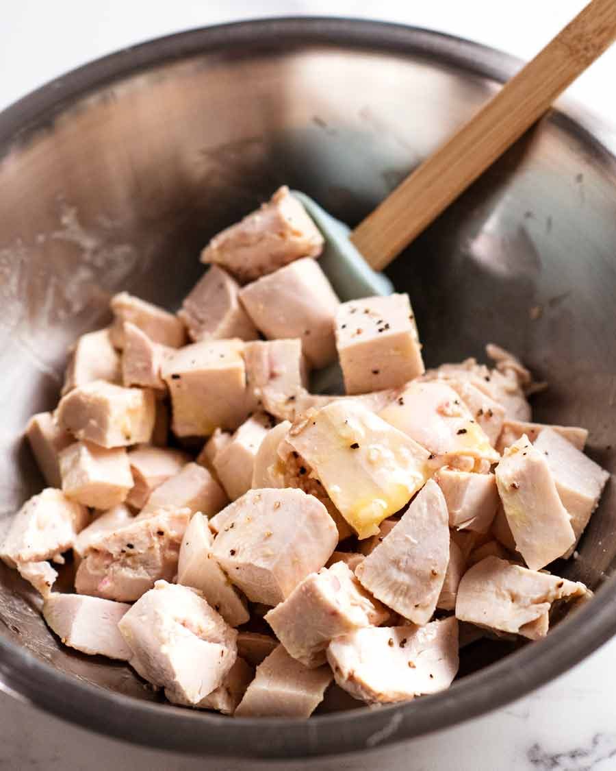 The mighty Cobb Salad Recipe Chicken tossed in dressing for Cobb Salad