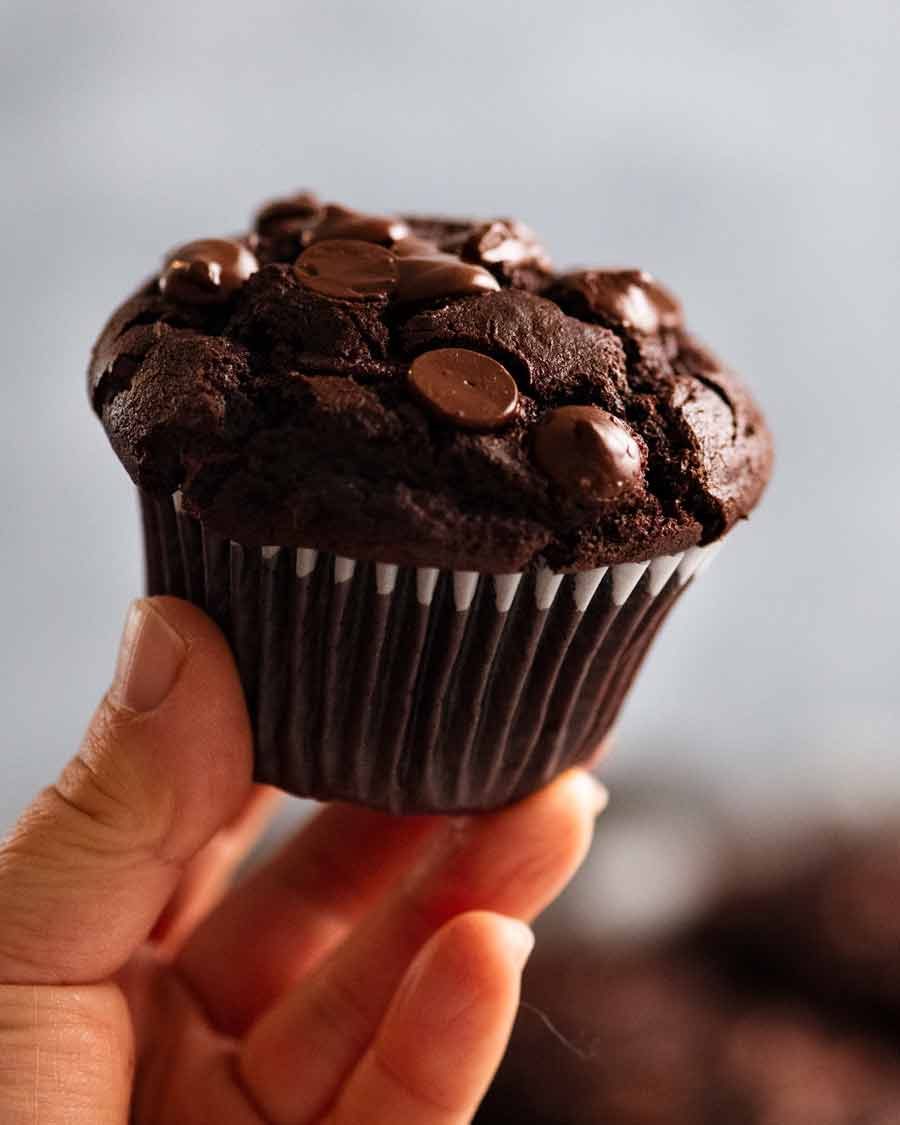Chocolate Muffins Recipe Hand holding Chocolate Muffin