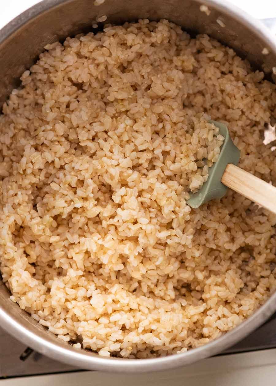How to Cook Brown Rice Recipe Pot of freshly cooked brown rice