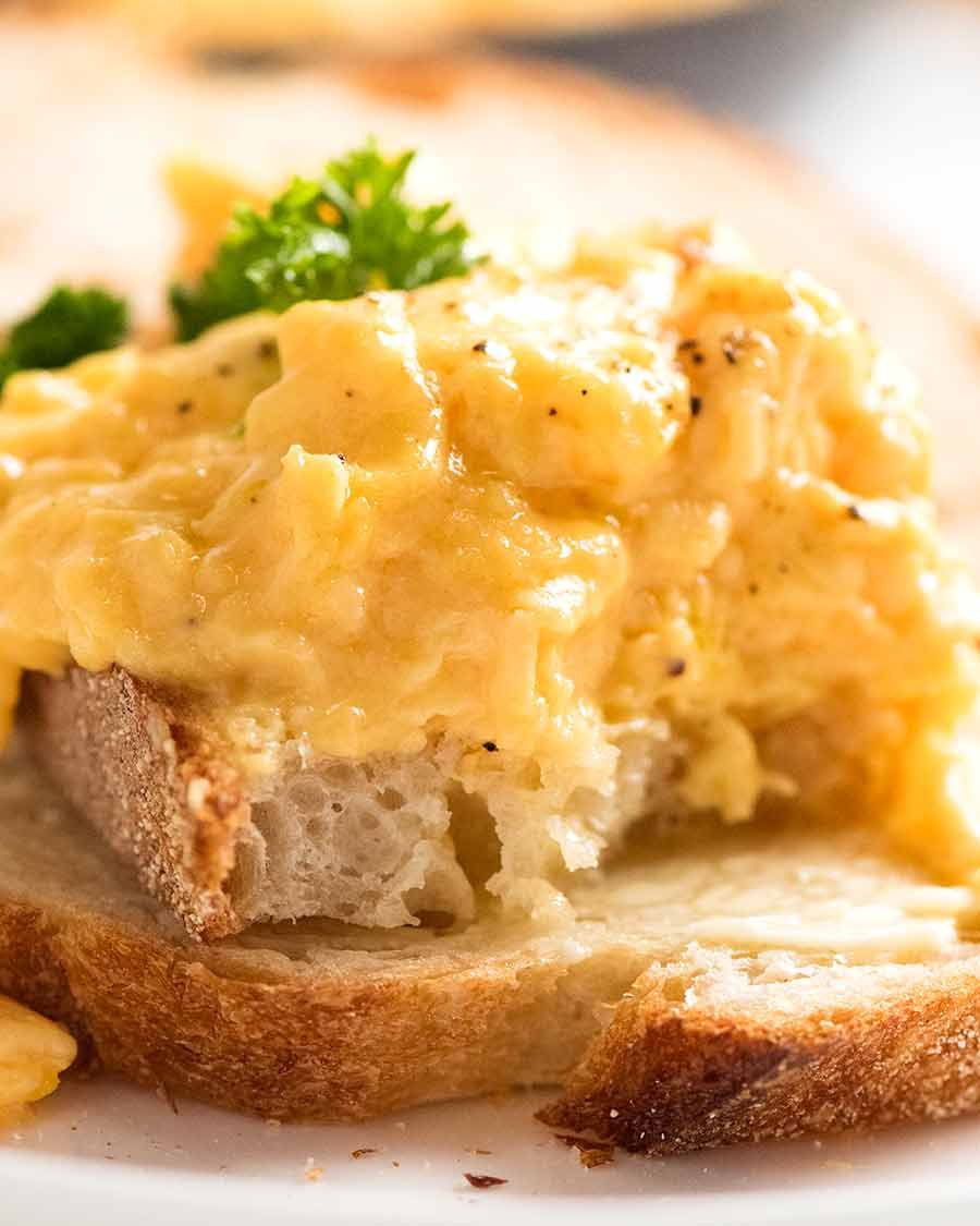 Scrambled Eggs Recipe Showing inside of soft Scrambled Eggs on toast