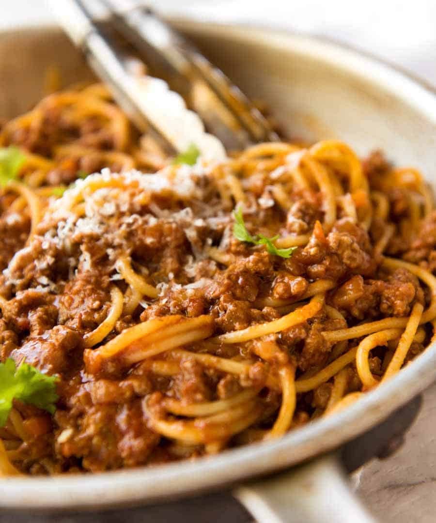 Spaghetti Bolognese Recipe Bolognese Sauce and pasta tossed in a pan, ready to be served.