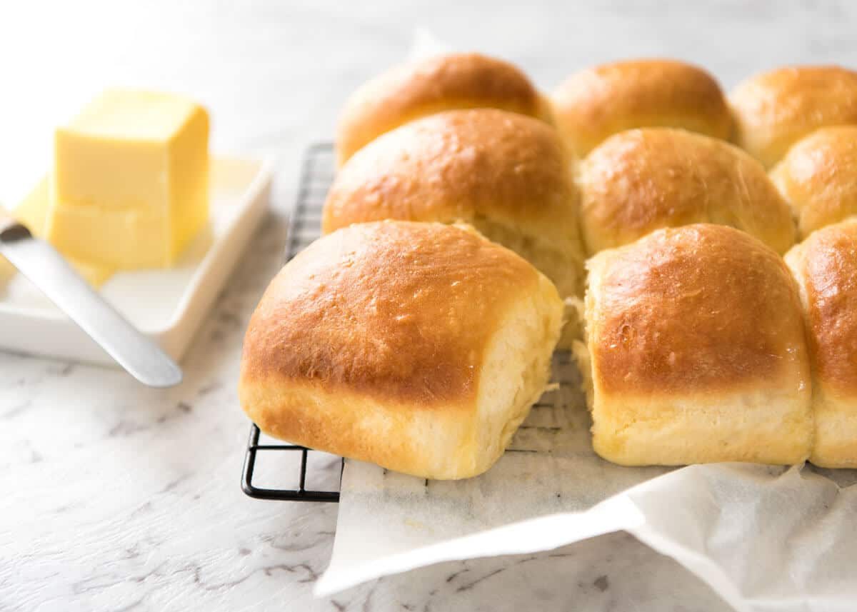 Soft No Knead Dinner Rolls Recipe Soft no knead dinner rolls on a rack, fresh out of the oven, ready to be eaten.