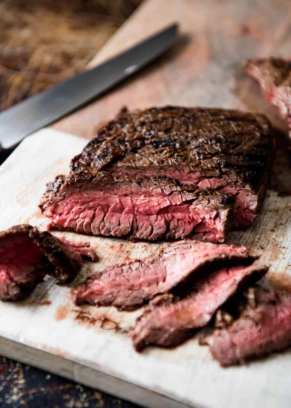 Steak Sandwich Recipe A juicy Steak Sandwich loaded with tender slices of steak, caramelised onion, garlic aioli, lettuce, tomato and mustard. www.recipetineats.com