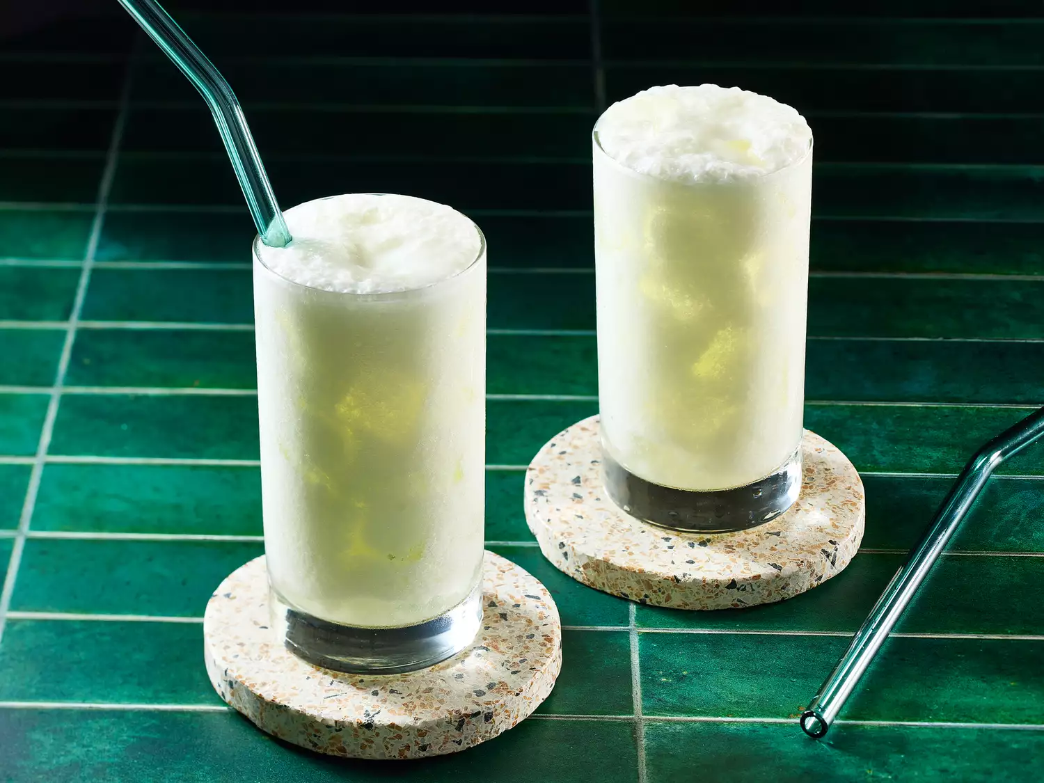 Two glasses with indian lassi with straws