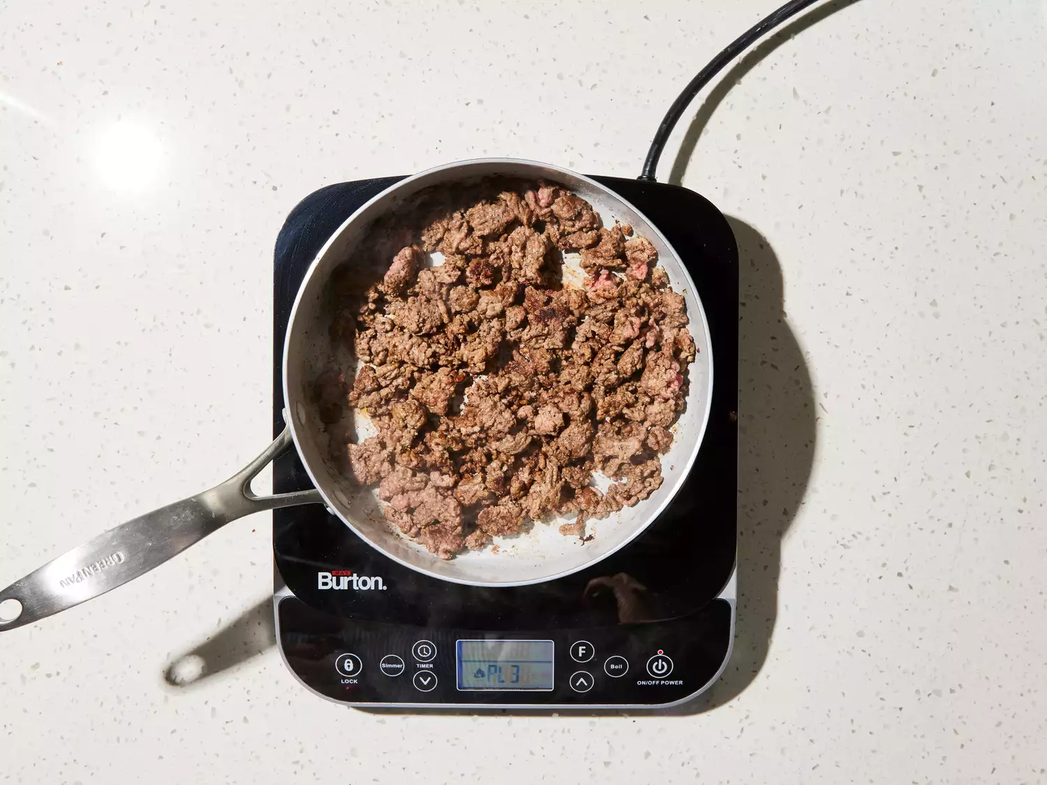 ground beef cooked in a hot skillet