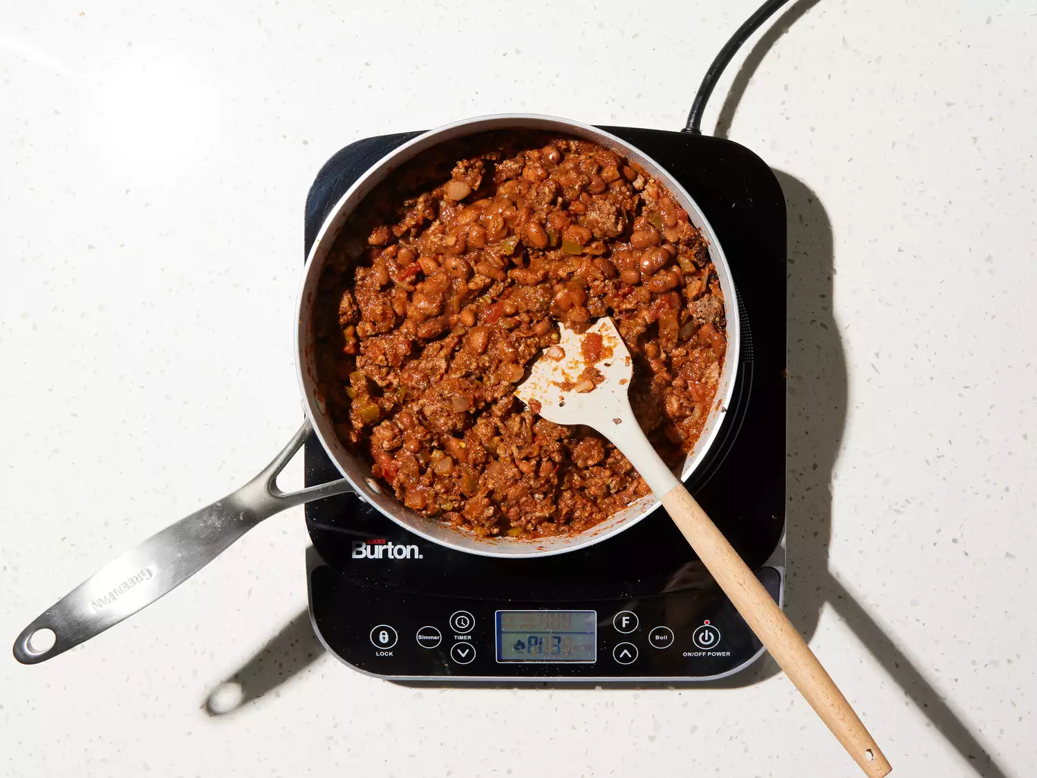 salsa and beans added to the skillet