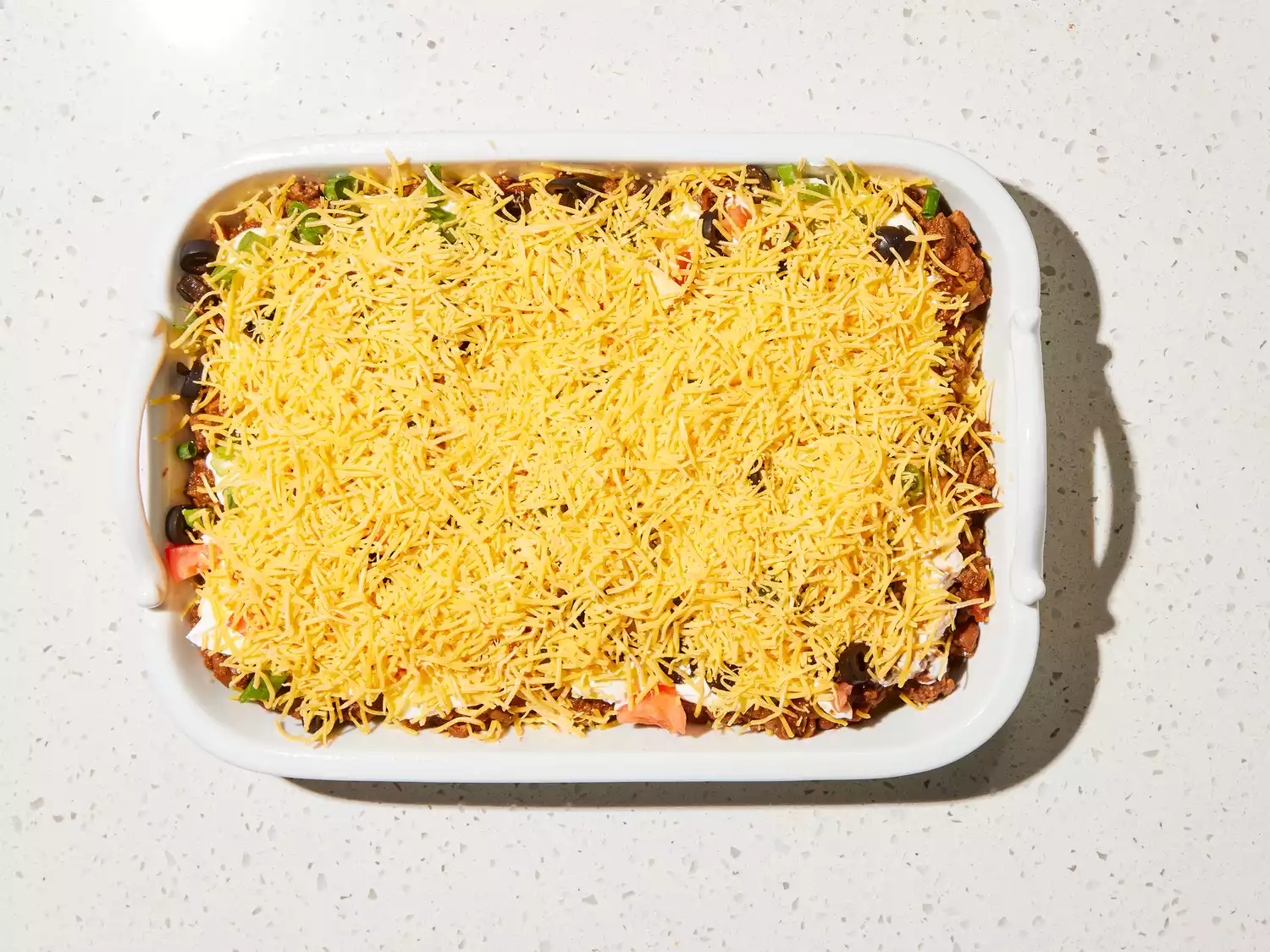 all mixtures layered in the baking dish 