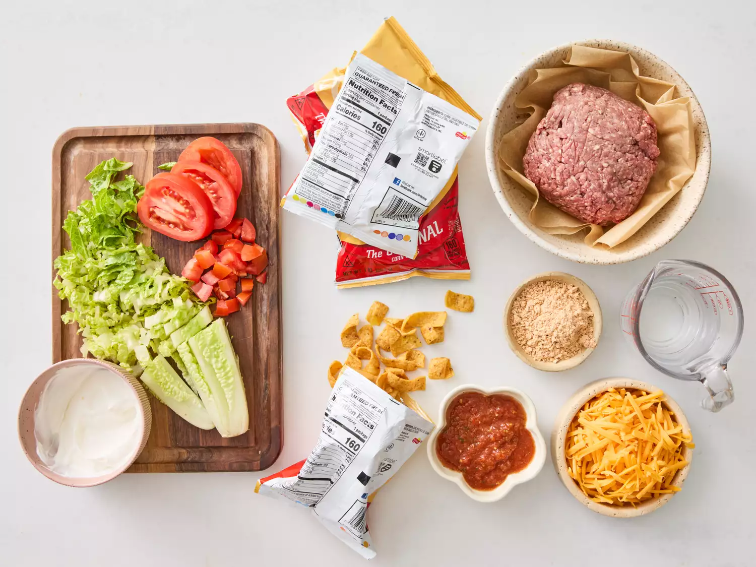 Raw ingredients for taco in a bag recipe on white surface
