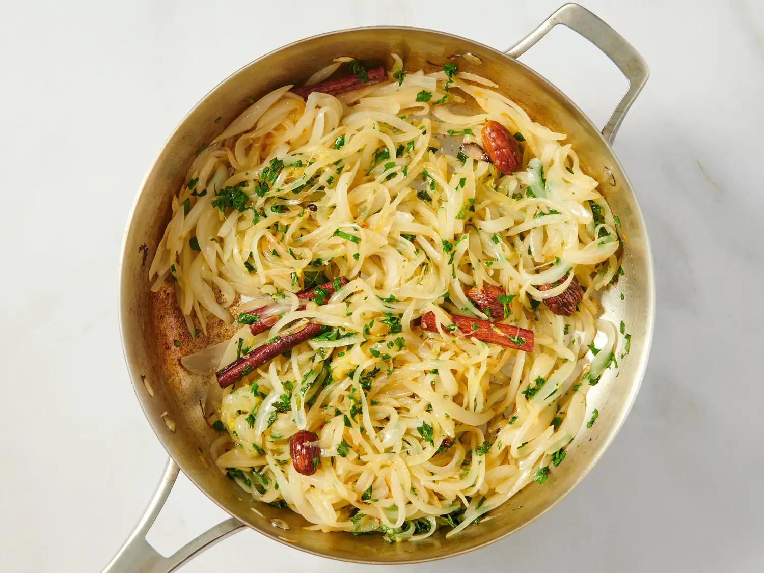Dish of noodles with herbs and spices in a pan