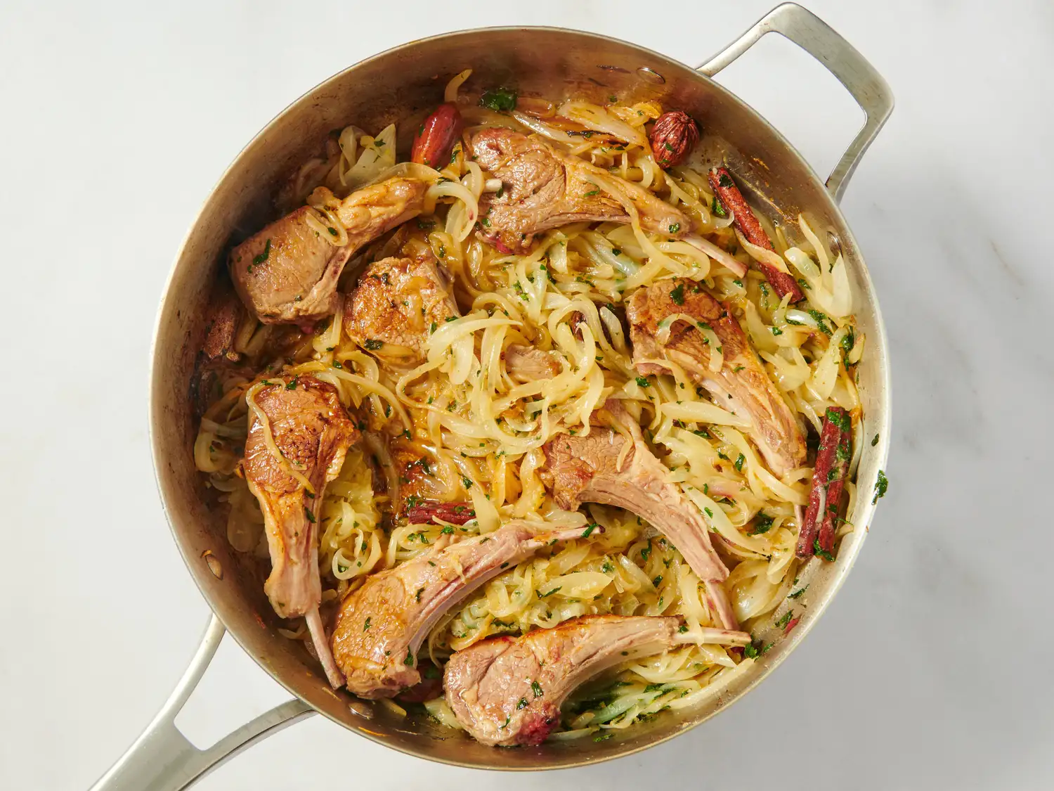 Lamb chops with onions and spices in a pan