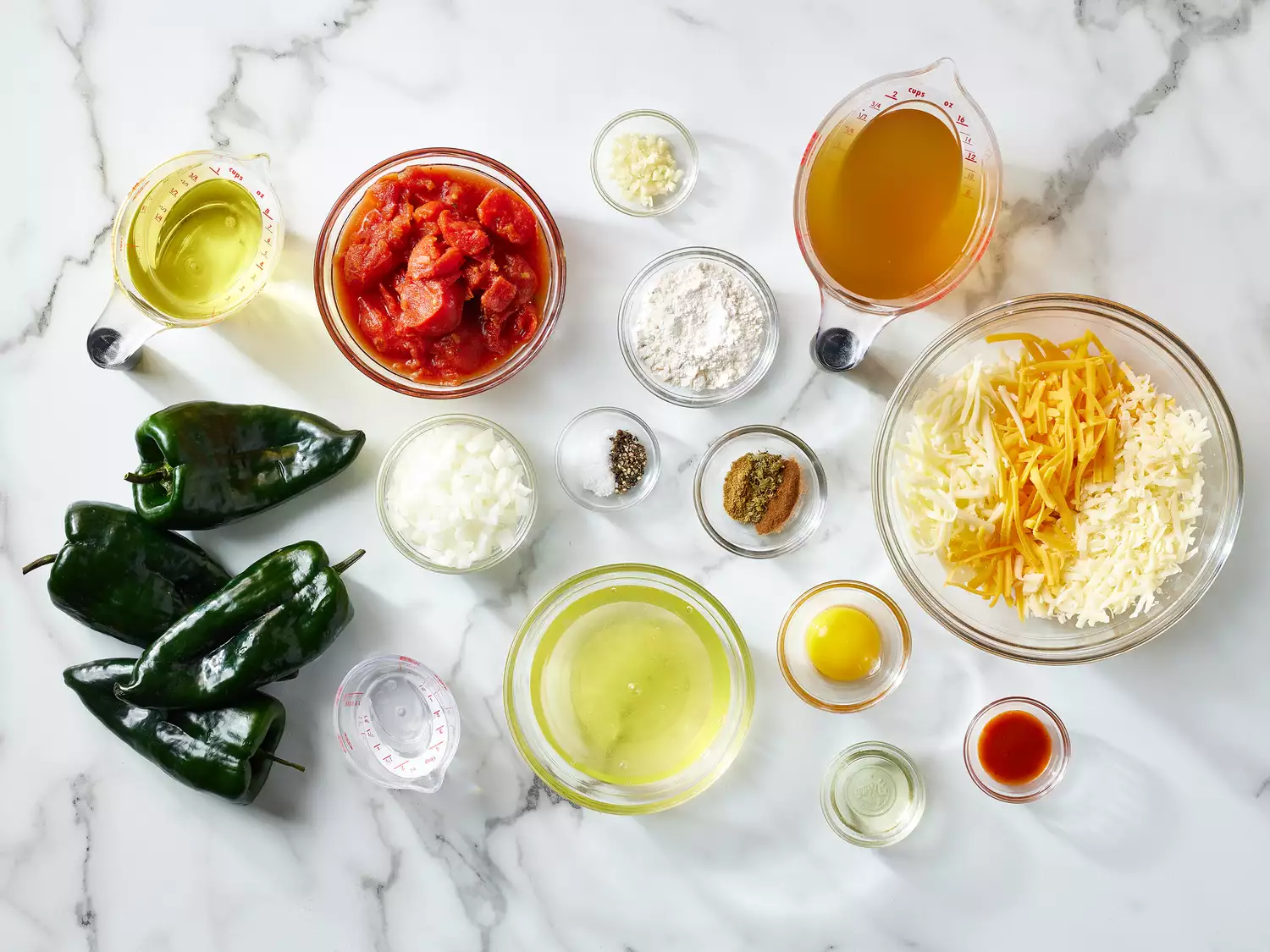Real Chiles Rellenos recipe ingredients on a marble counter 