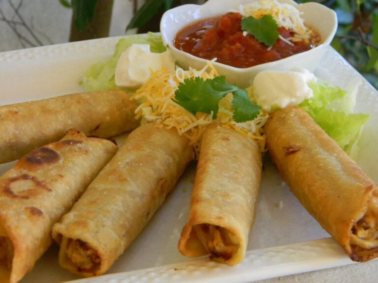 Crispy flautas with bowl of salsa