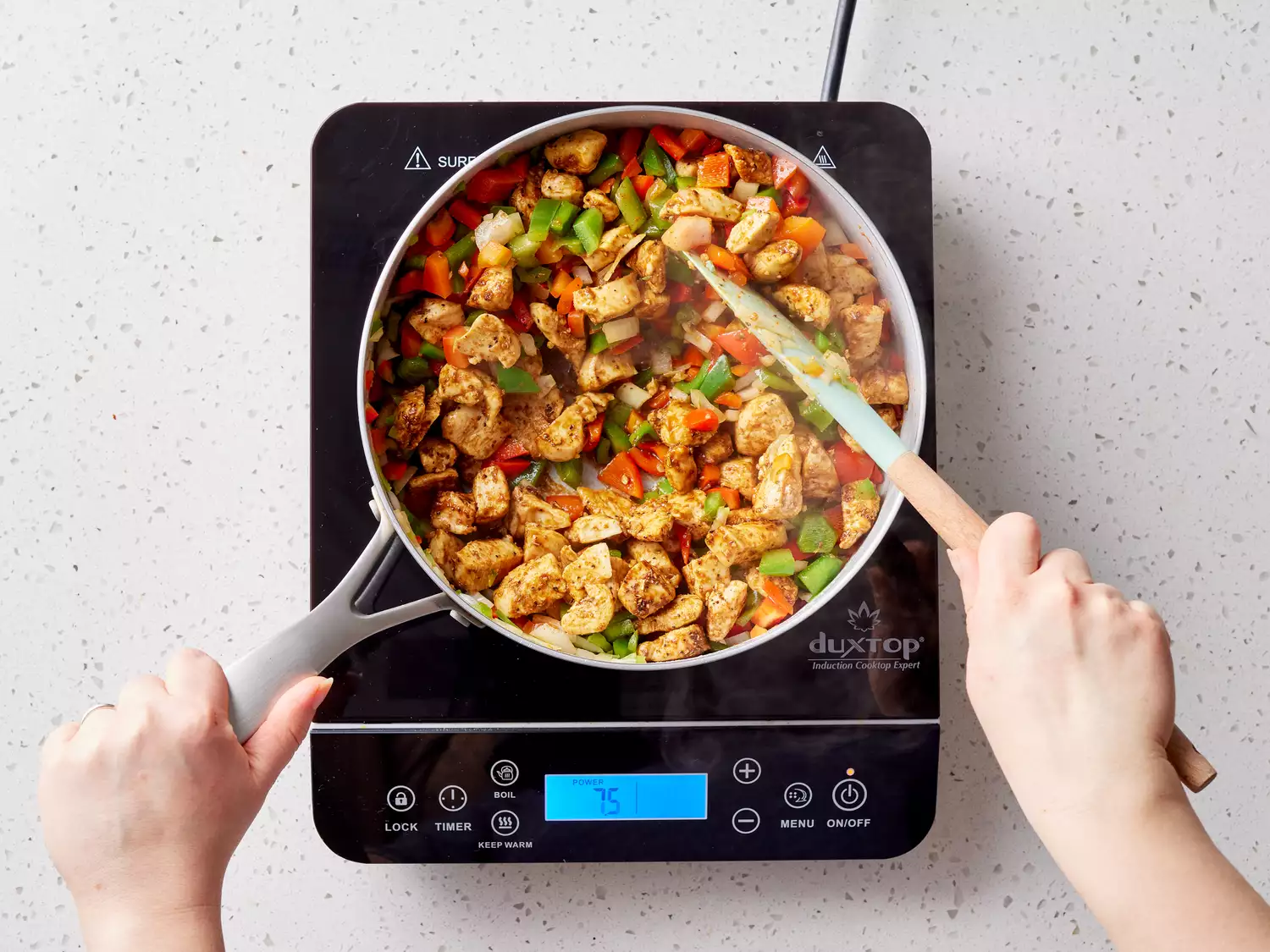 vegetables and chicken cooking in a skillet until vegetables are soft