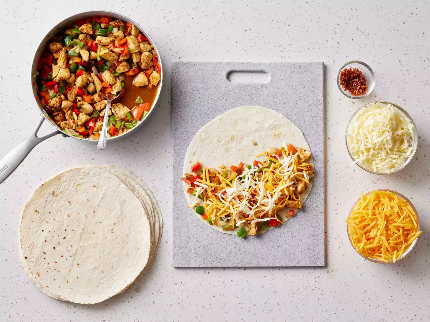mixture and cheese placed onto a tortilla