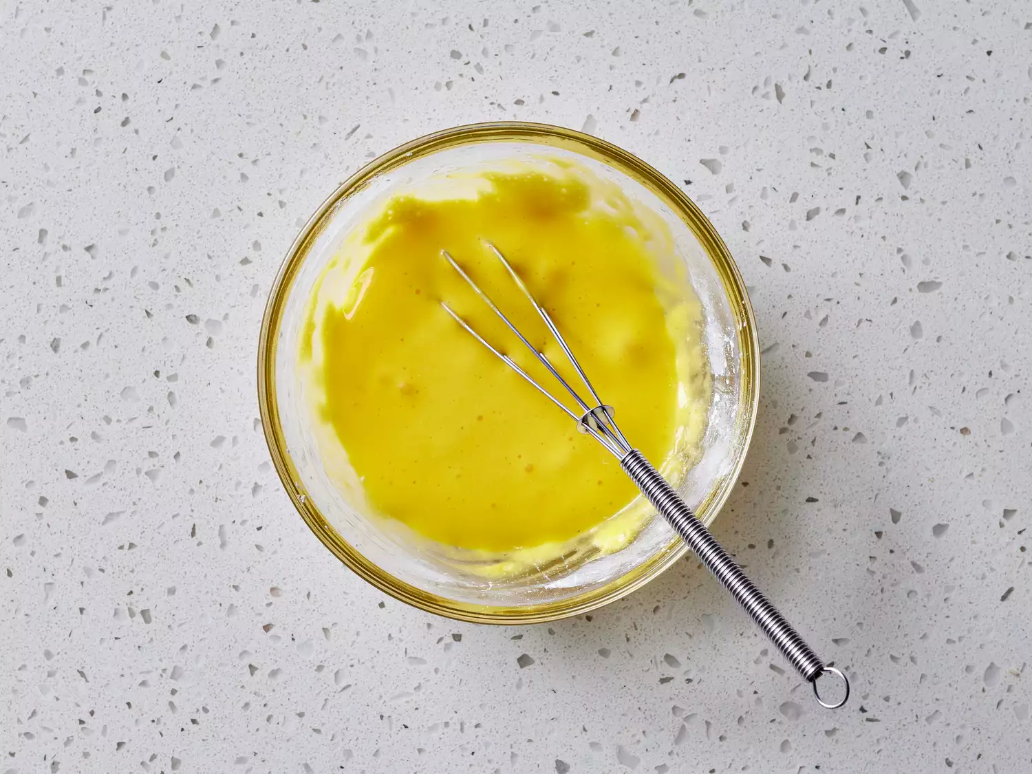 egg yolks and baking powder whisked together in a bowl