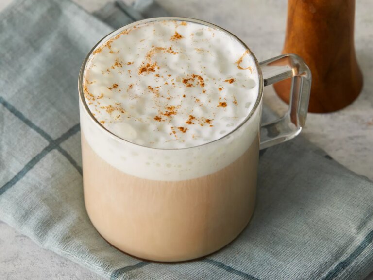Close up on a glass mug of chai tea latte