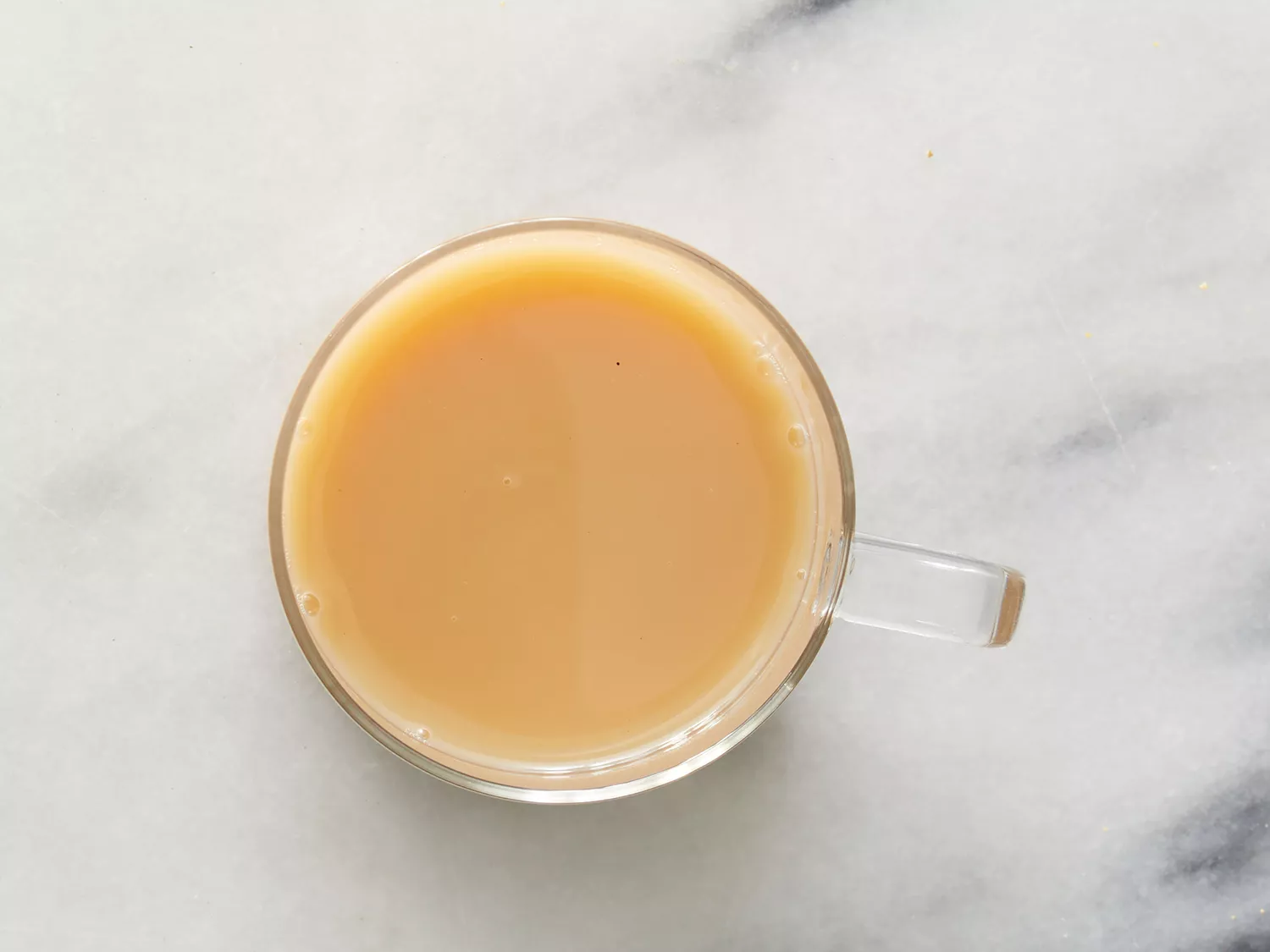 an overhead shot of a chai tea latte in a mug