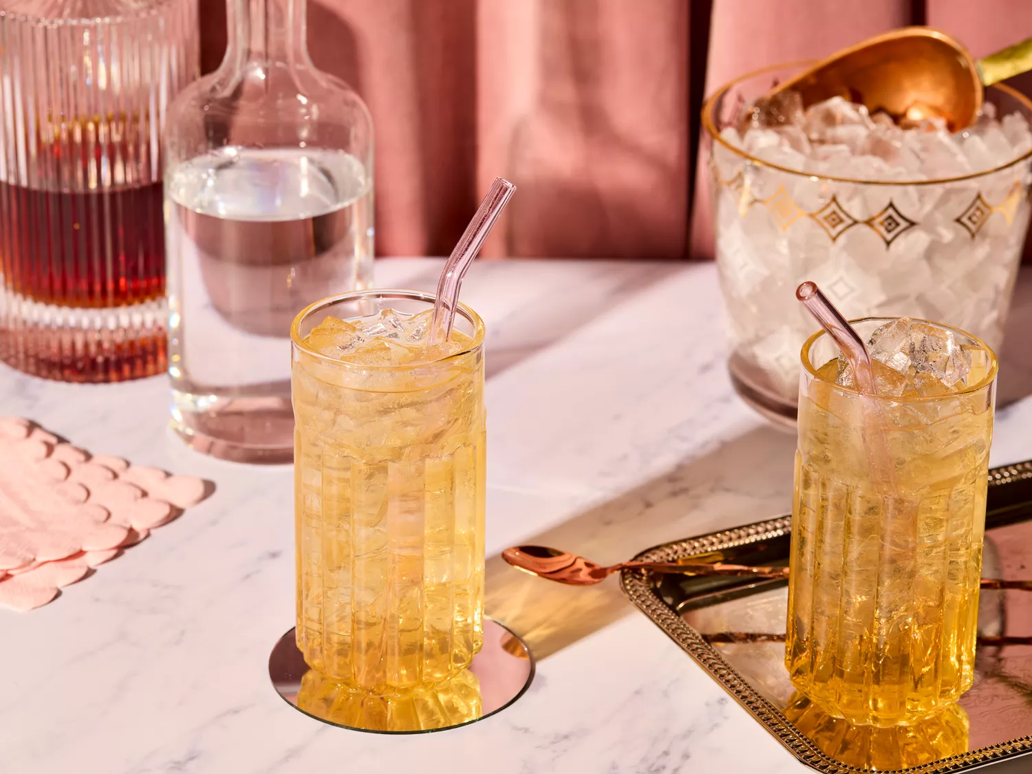 Two glasses of grateful dead cocktail with ice on a decorated table