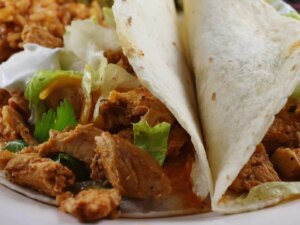 Close up view of chicken taco filling on a plate