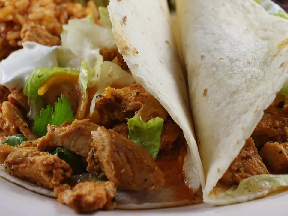 Close up view of chicken taco filling on a plate
