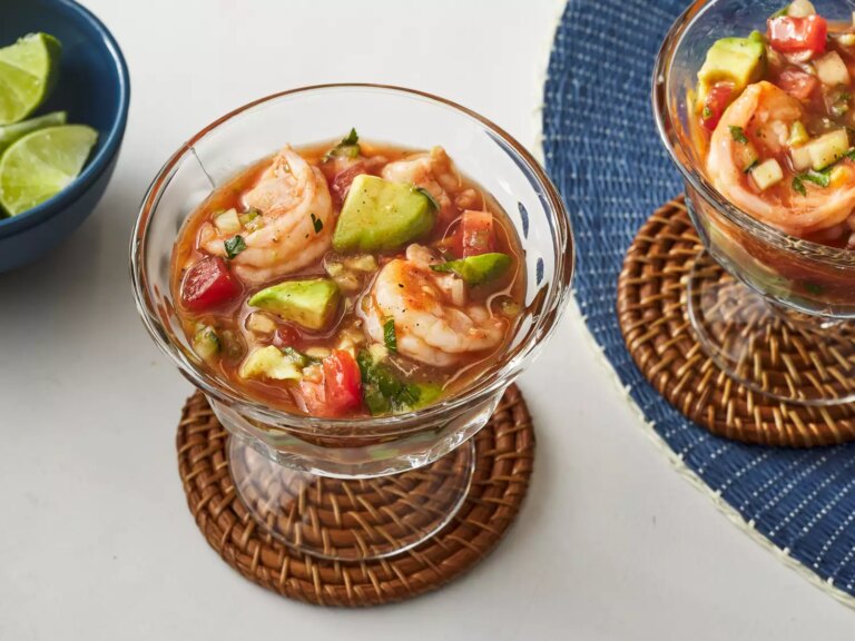 A high angle view looking into a cup of authentic mexican shrimp cocktail.