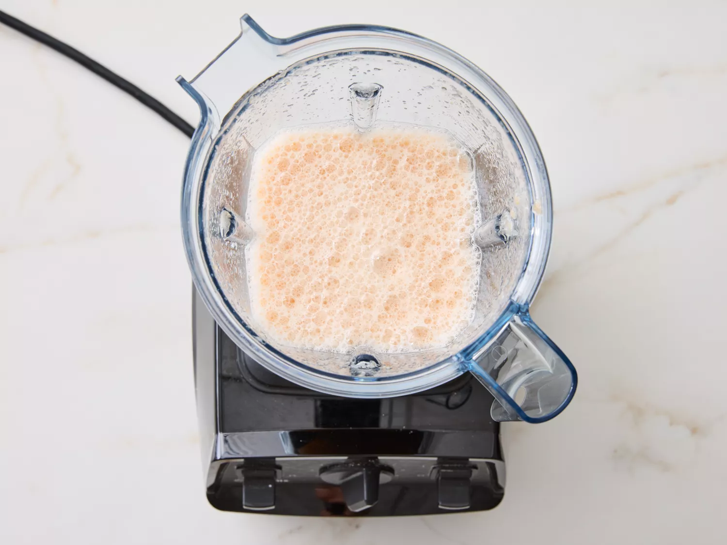 Blender with blended liquid inside, viewed from above