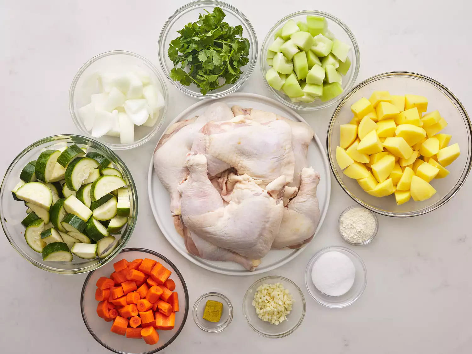 Caldo de Pollo ingredients in glass bowls 