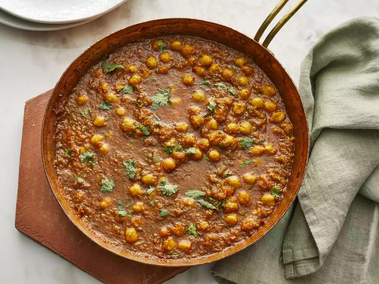 Looking down at a skillet of chana masala
