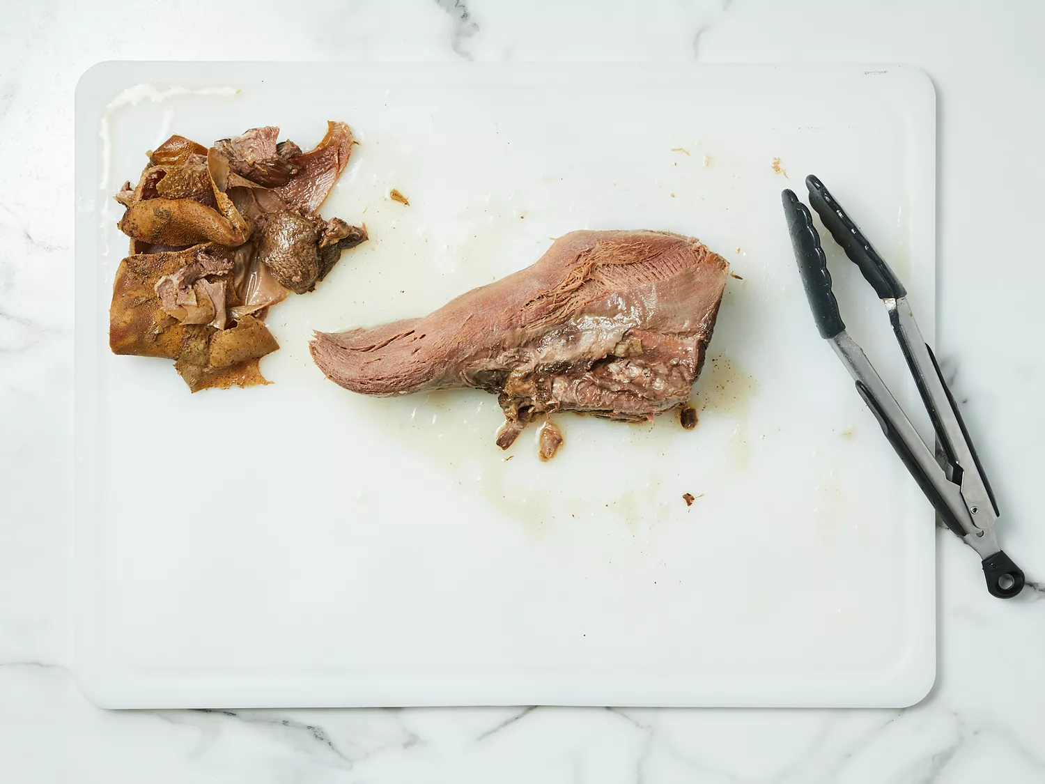 Skin and rough end removed from beef tongue.