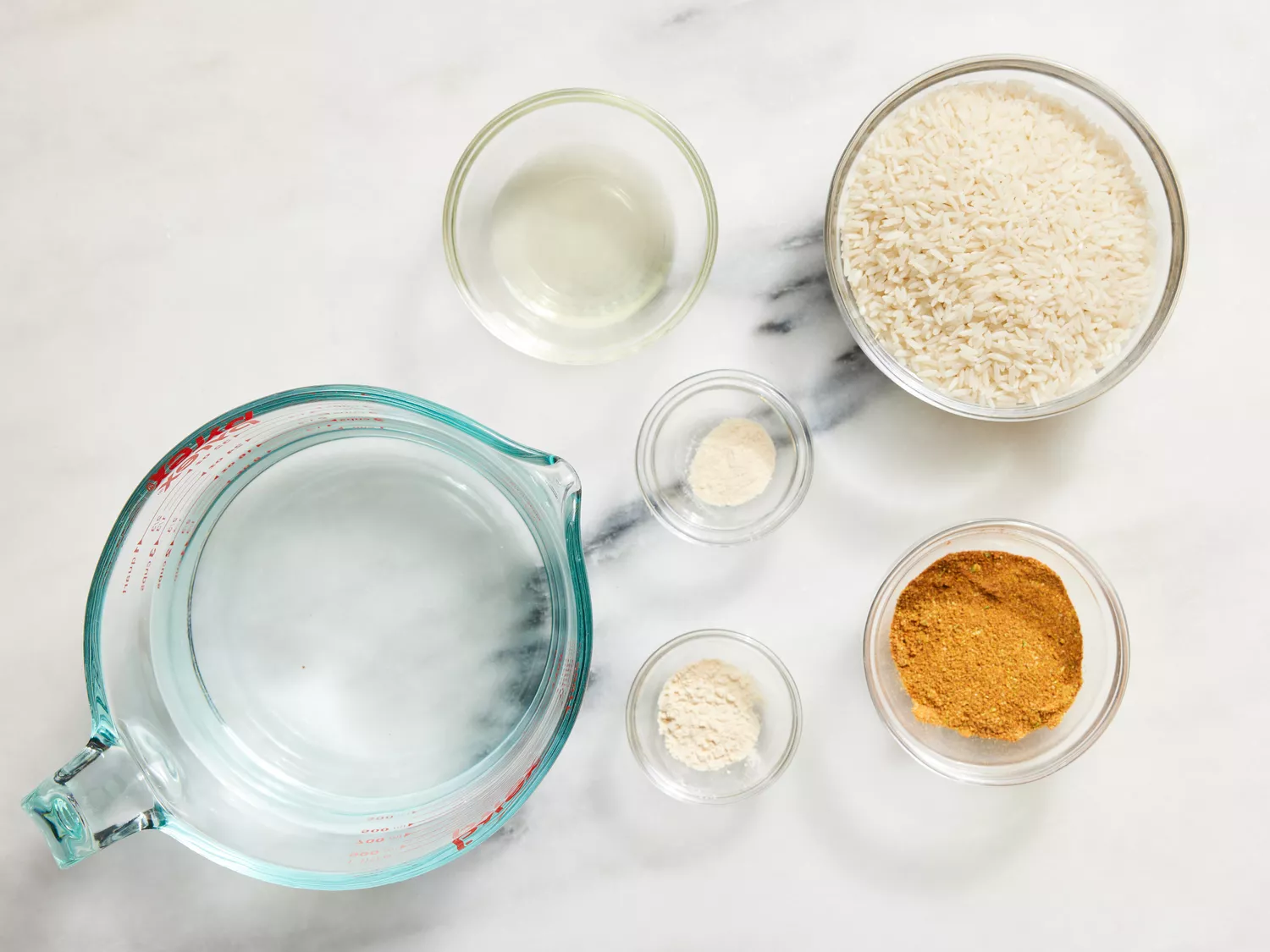 all ingredients gathered to make Mexican tomato flavored rice.