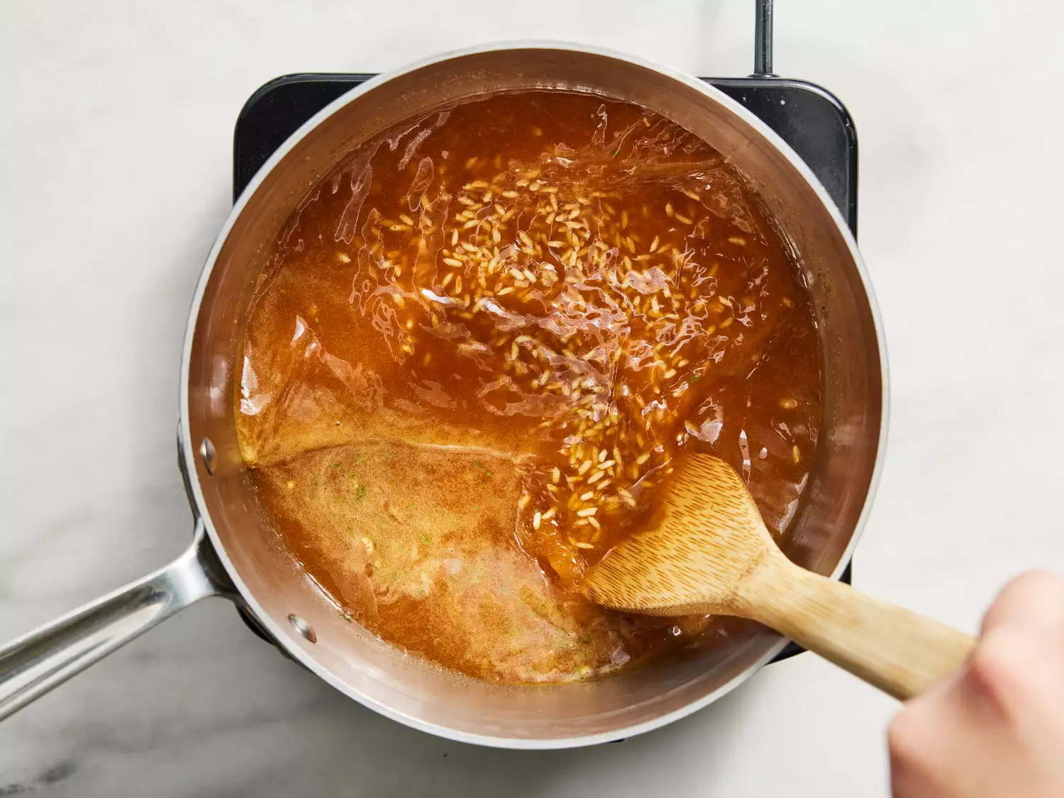 water gradually stirred in with tomato, onion and garlic powders added.