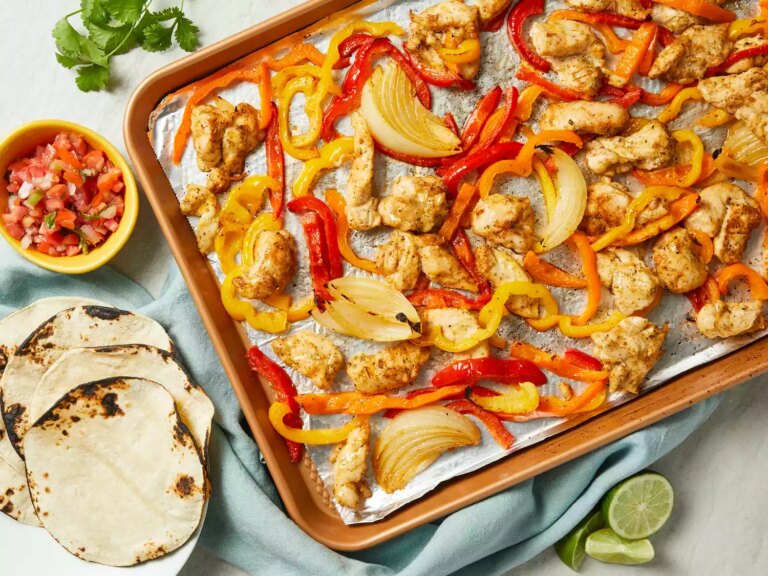 Looking down at a sheet pan of chicken fajitas