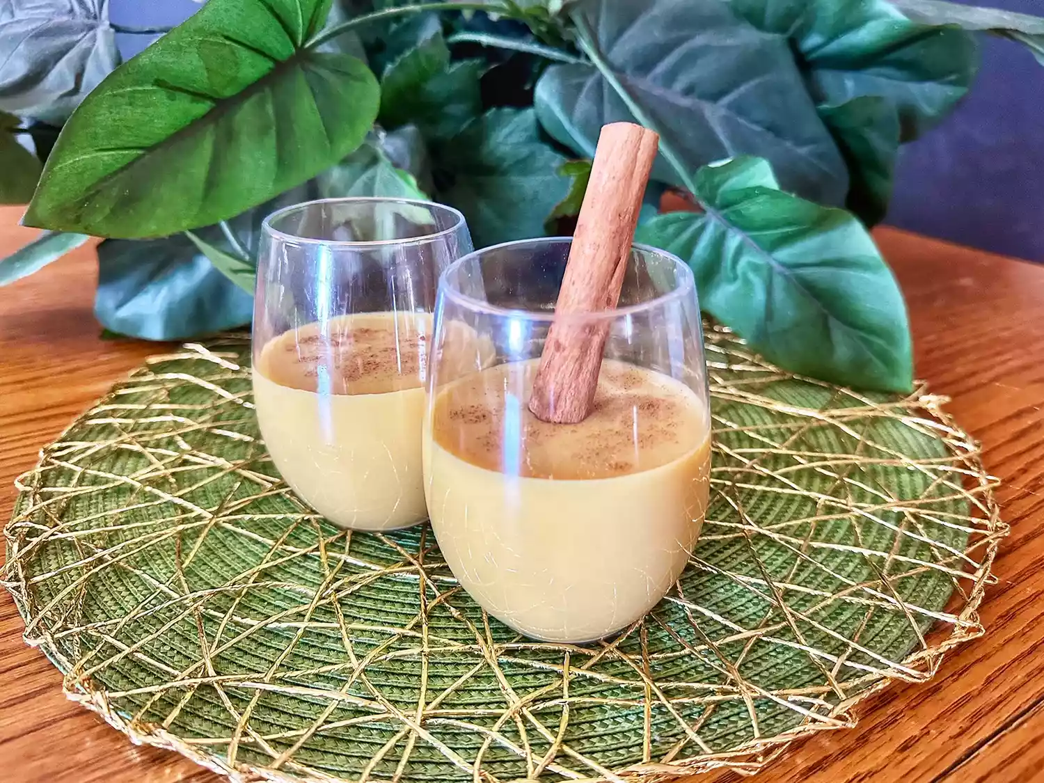 Rompope mexican eggnog in 2 classes garnished with cinnamon stick