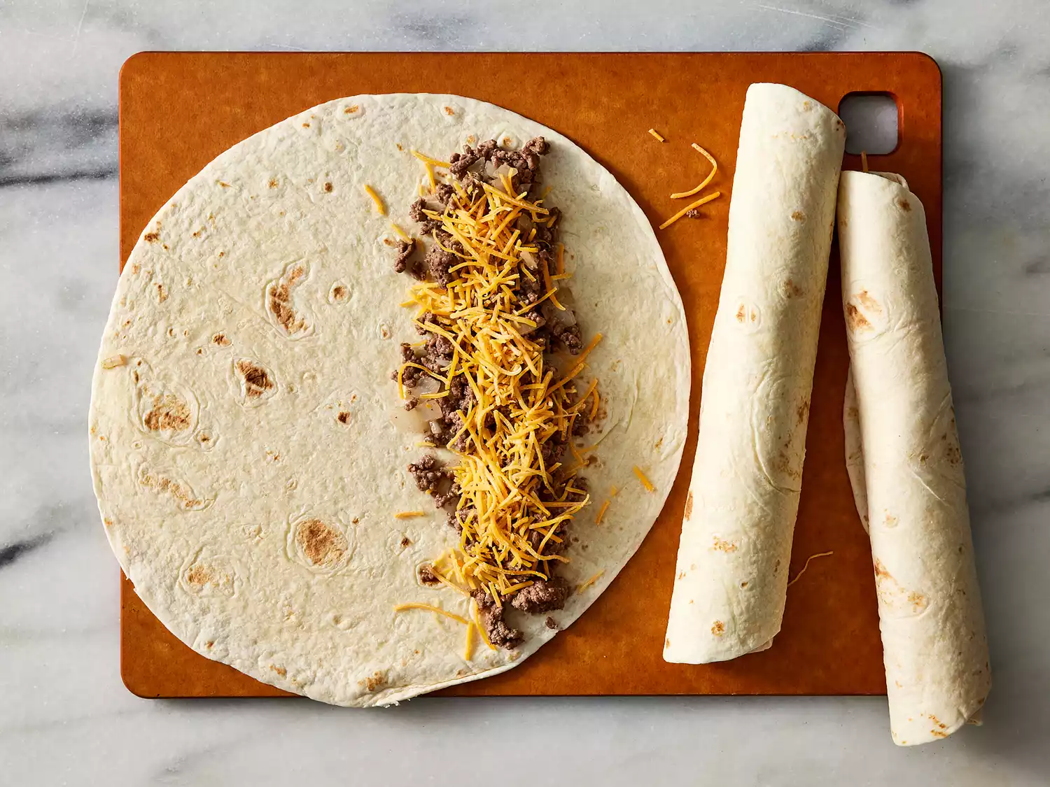 Equal parts of beef and cheese added to tortillas.