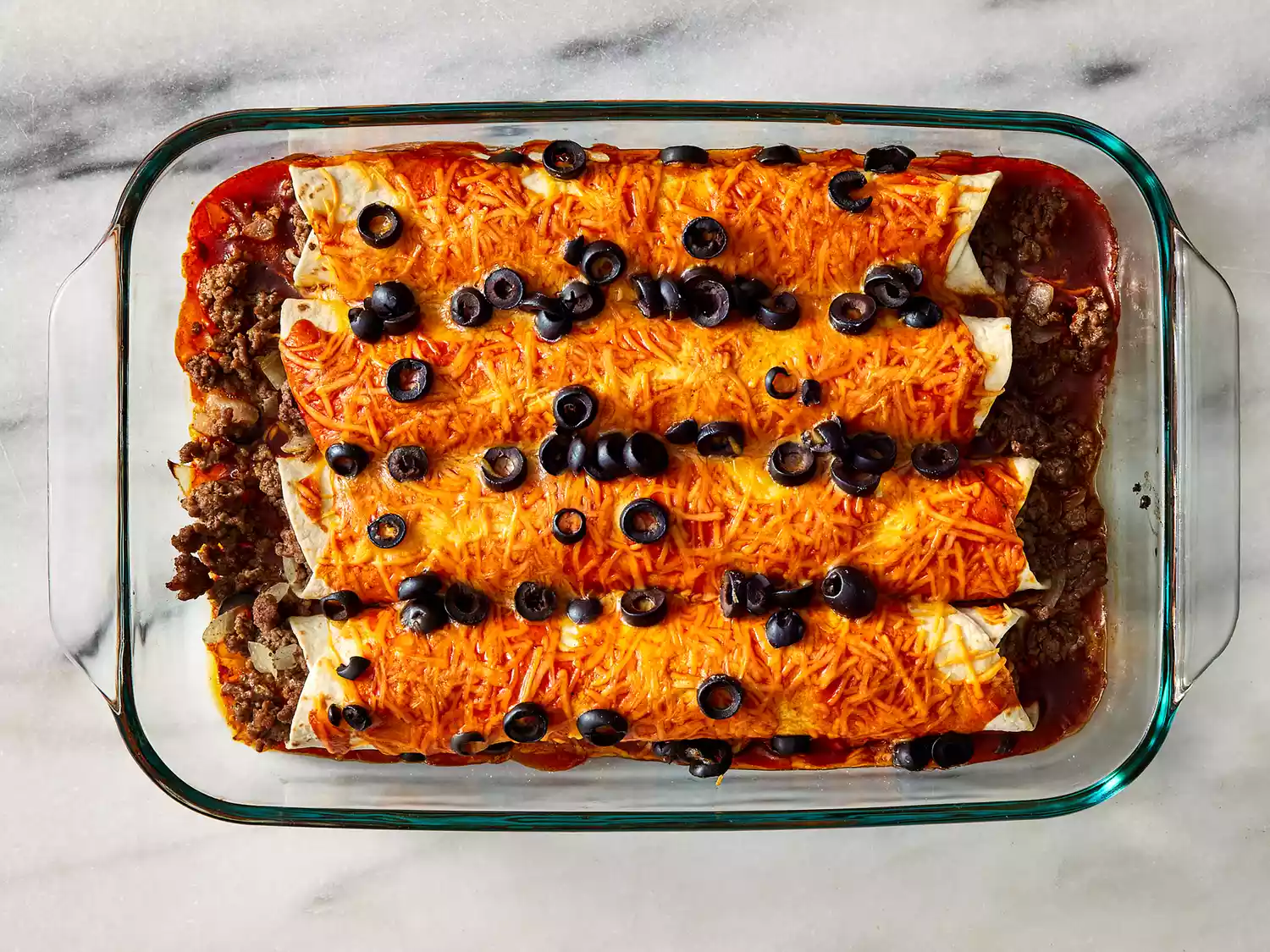 Enchiladas baked until browned and bubbly.