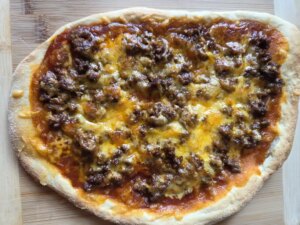 Mexican fiesta flat bread topped with ground beef and cheese