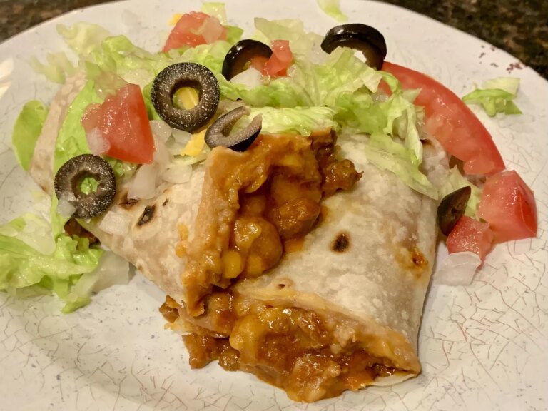 Sloppy joe burritos with salad and olives